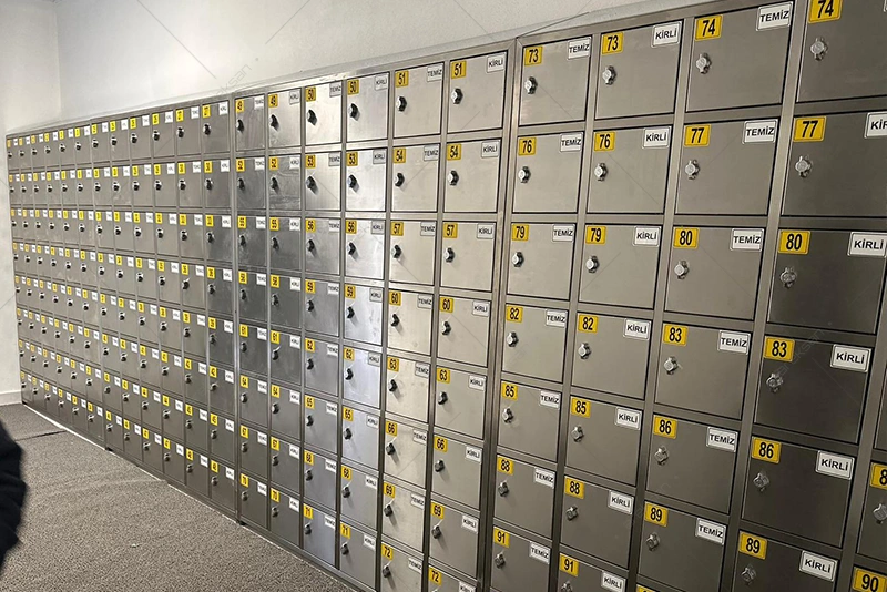 Areksan custom manufactured stainless steel personal effects locker food production facility installation view